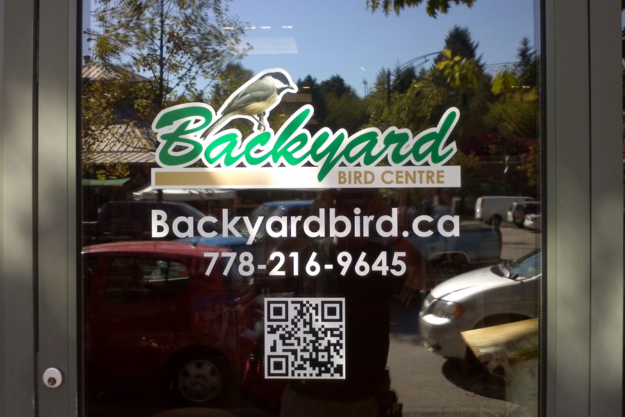 DIgital printed vinyl, gloss laminated, contour cut, installed on door.